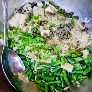 green bean, orzo, cheese, parsley, and capers with red wine vinegar dressing